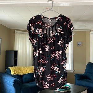 Black and floral ribbed shirt with cut outs. Never worn!